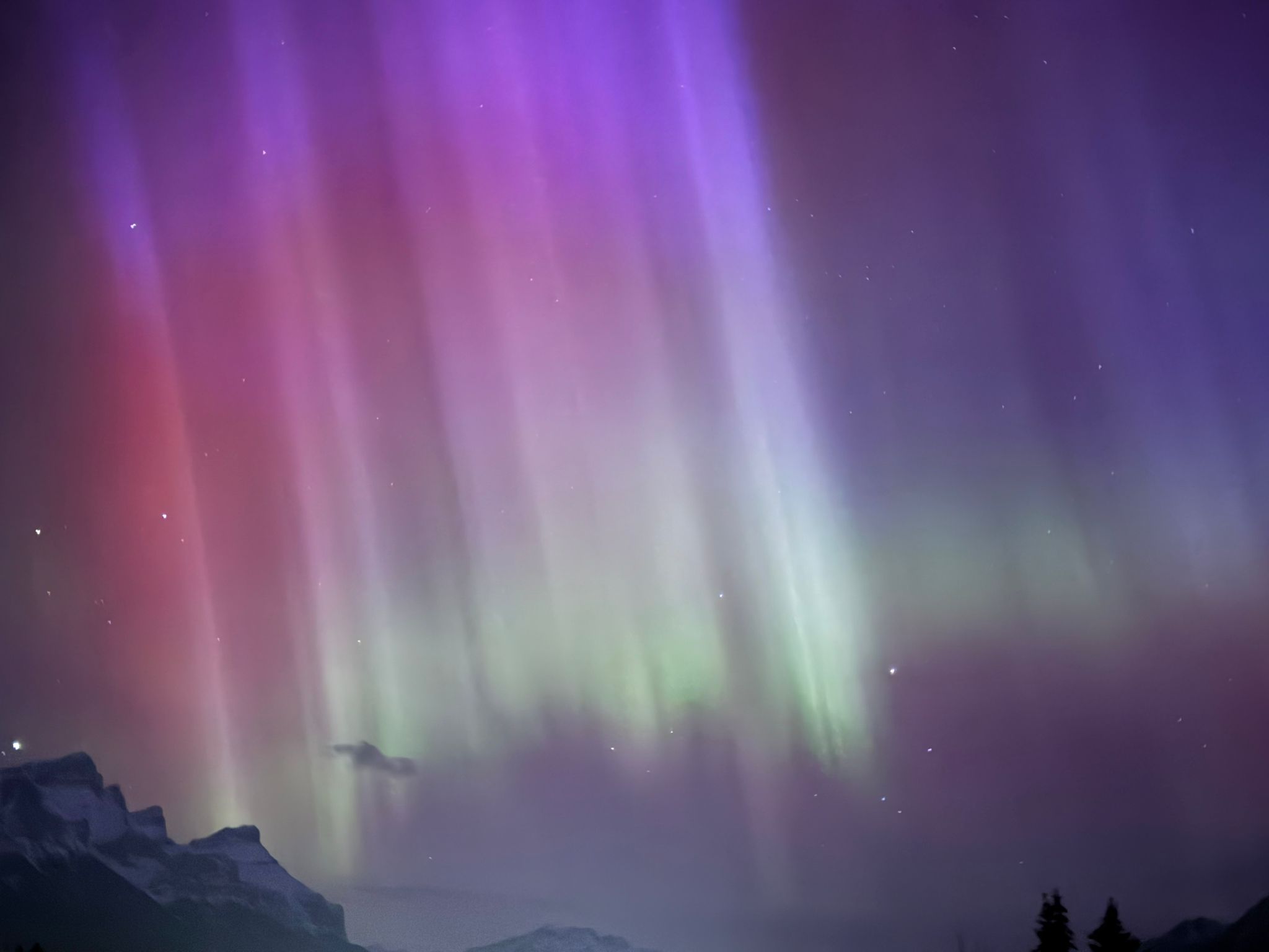 Purple, red and green aurora displays seen in the sky over Canada because of the solar storms 