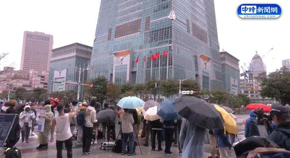 people on street in rain