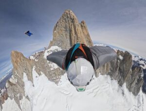 Two people BASE jumping from Fitz Roy in Patagonia.