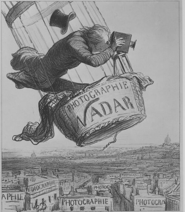 Drawing of a man in a hot air balloon with a camera