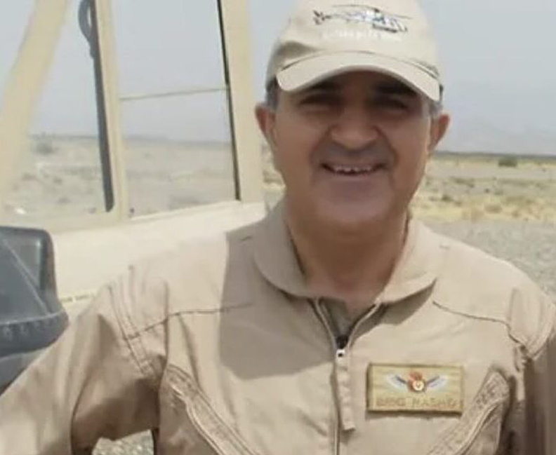 man in khaki clothes and ball cap