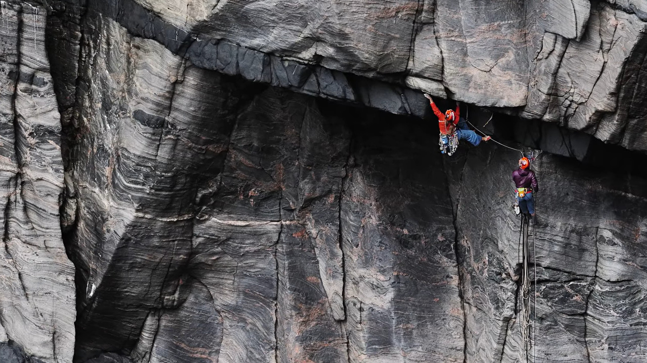 Two climbers on a basalt overhang