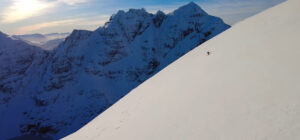 lone skier on gentle snowy mountain