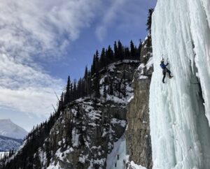 A climber on a free-standing water ice column.