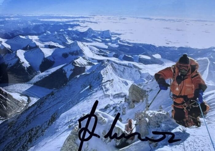 An old photo of Messner on a snowy kilimanjaro, signed .