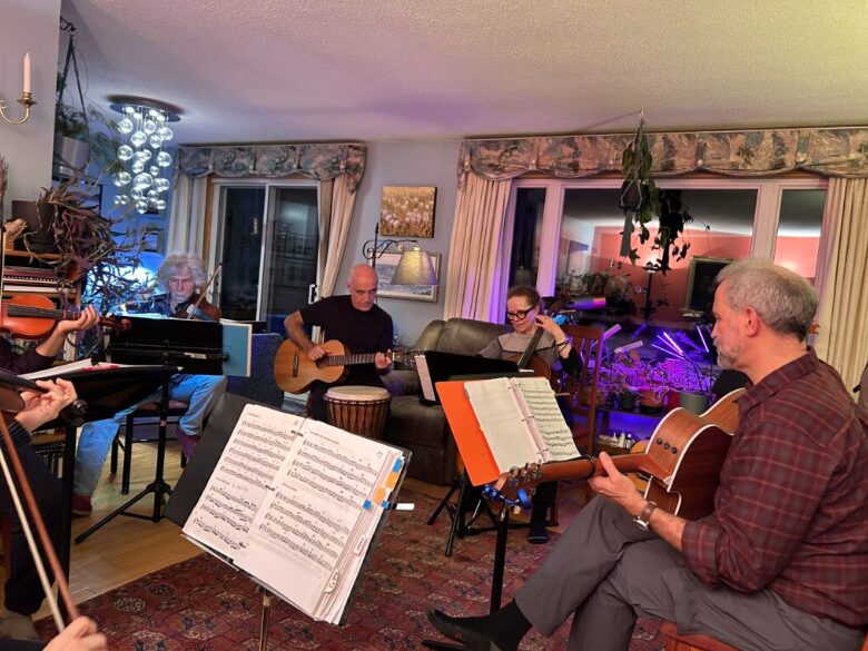 A group of 7 musicians gather in Matty McNair’s living room in Iqaluit.