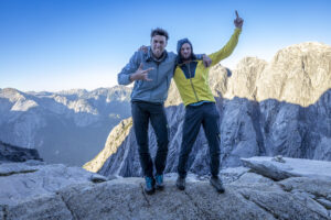 Climbers on a flat rocky summit.