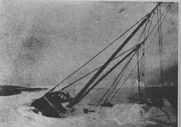 b/w photo of old wrecked sailboat.