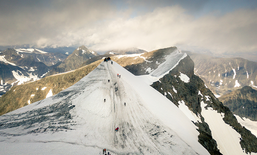 drone image of snowy mountain peak