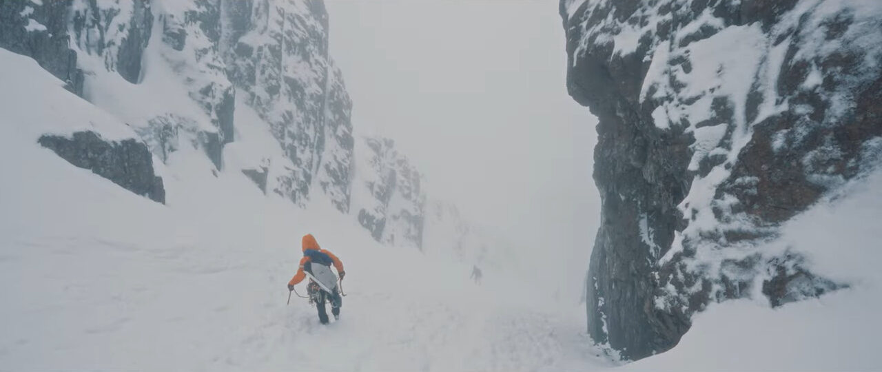 A man walking away in thick snow