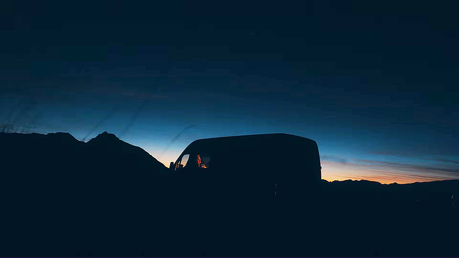 A van parked in the pre-dawn light