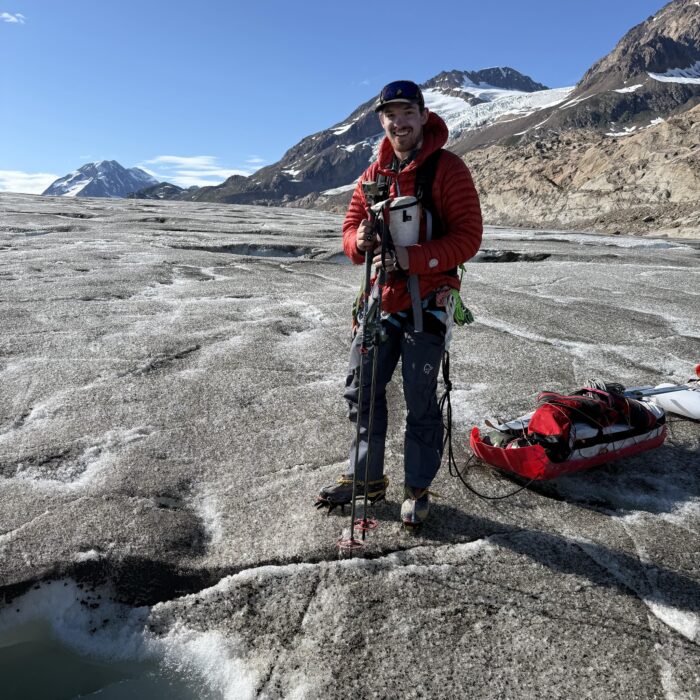 Man standing on Alaskan glacier