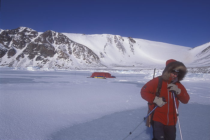 man near arctic ice camp