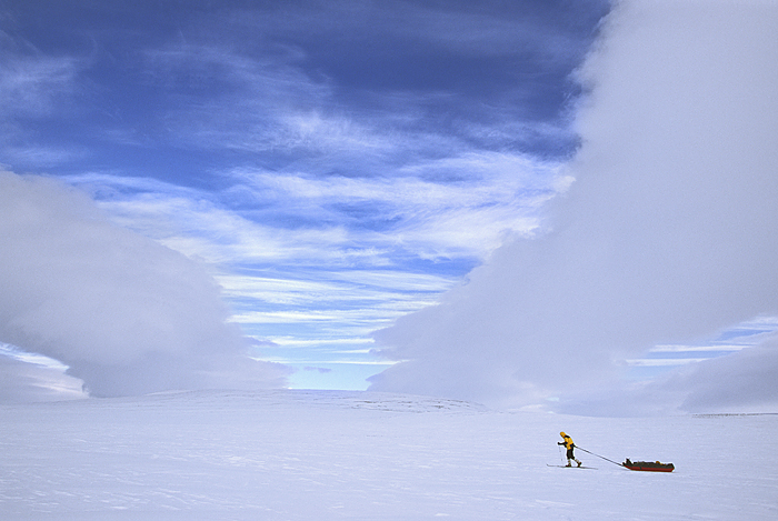 sledding with background clouds