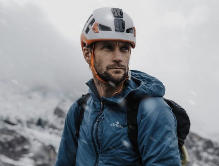 Close shot of Tim Howell in mountaineering clothes and helmet.