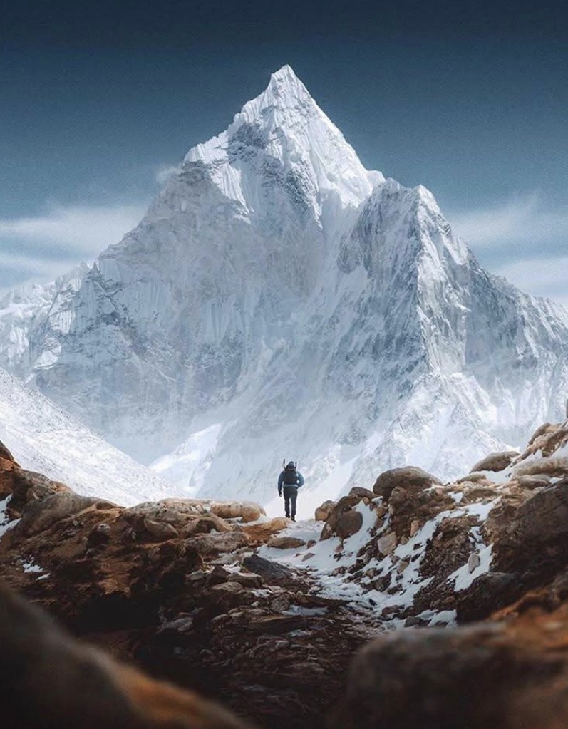 A hiker trekking toward Ama Dablam.