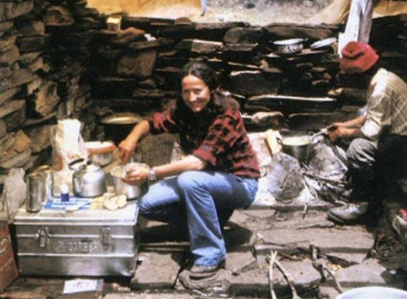 woman in plaid shirt in camp