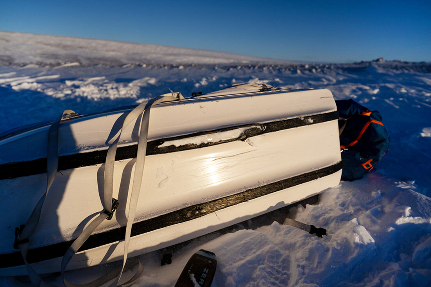 sled on its side with damaged runners