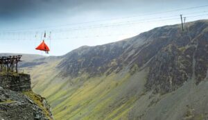 A bright orange tent hangs over the Honister Pass