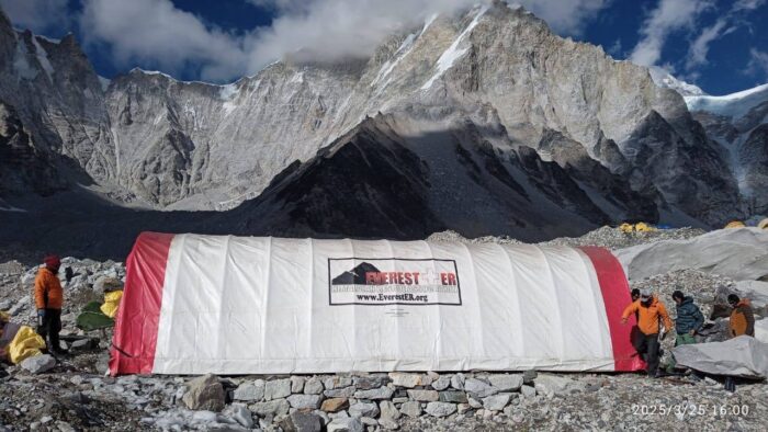 A tubular tent with the logo of the HRA at Everest Base Camp
