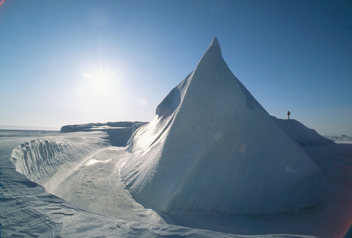 small figure on iceberg