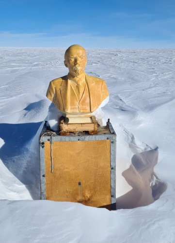 A bust of Lenin at the Antarctic Pole of Inaccessibilty surrounded by snow.