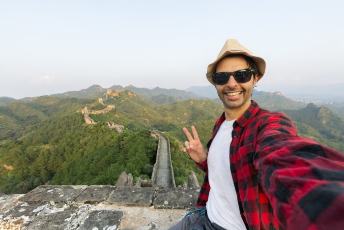 Tourist taking a selfie on the Great Wall of China