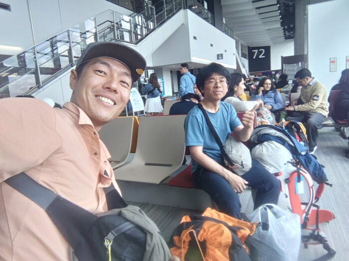 Two climbers at an airport.