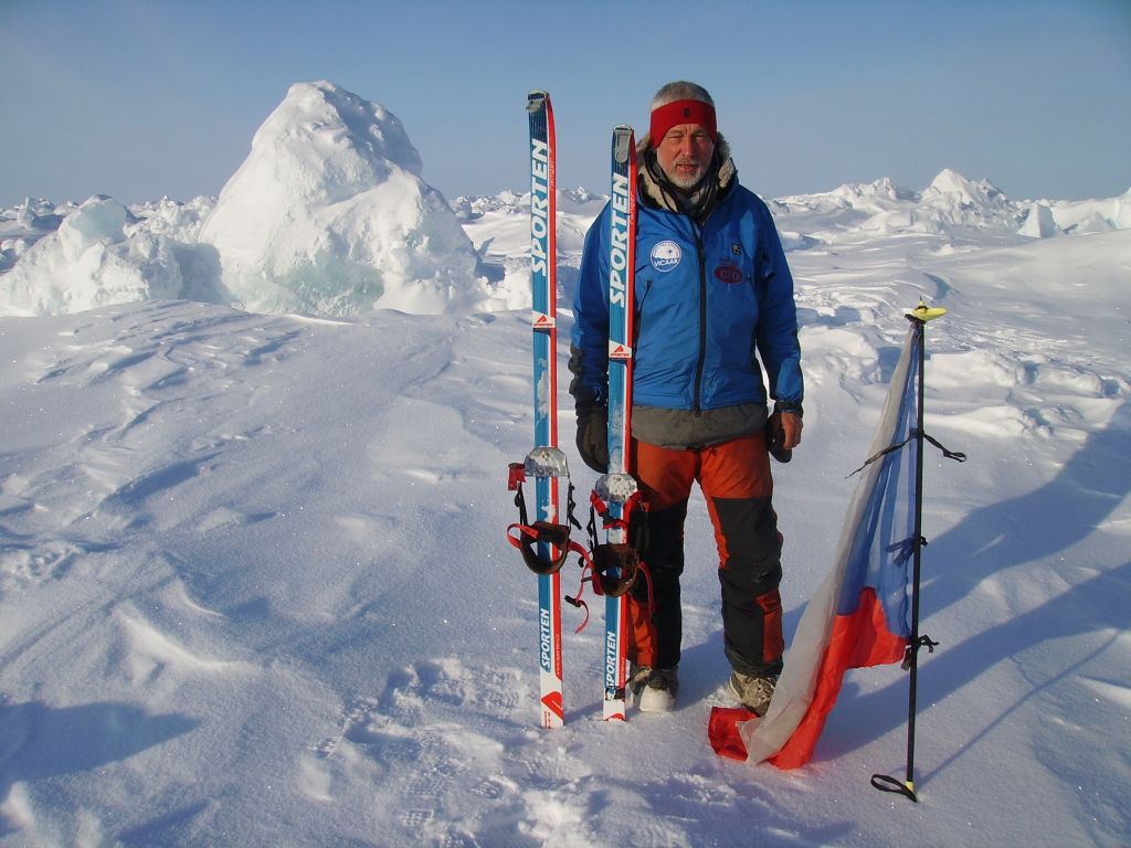 man standing on sea ice at the north pole