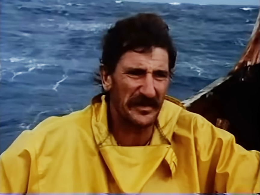 moustached man in yellow sou'wester