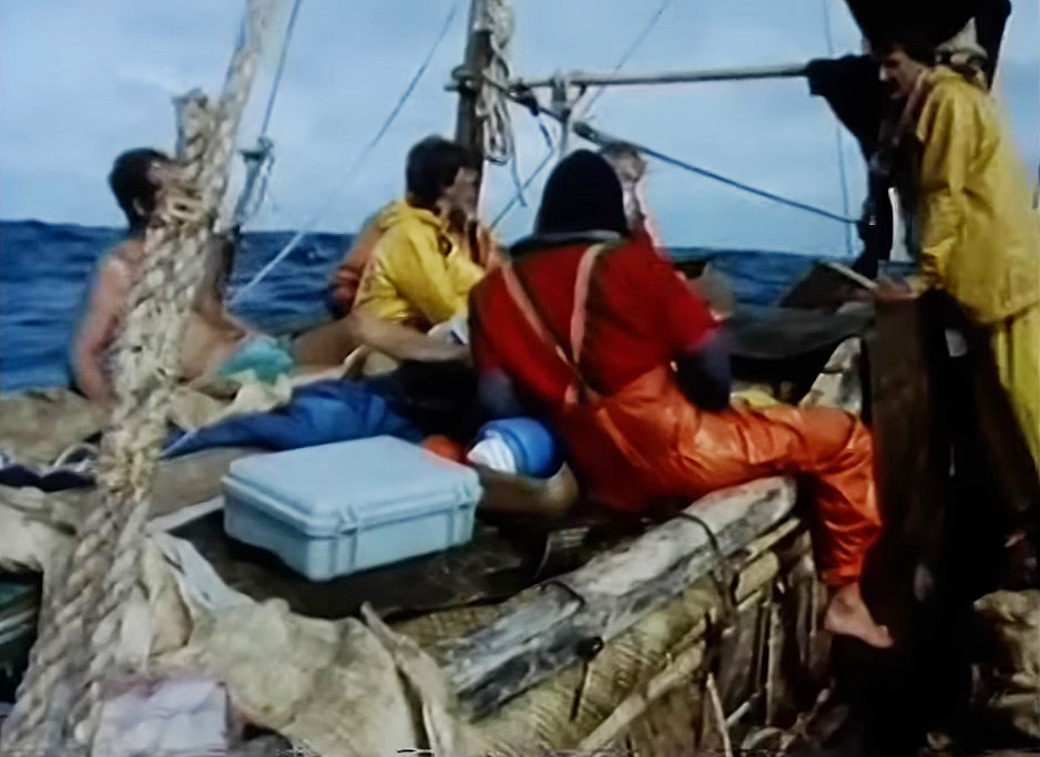 men on a primitive boat