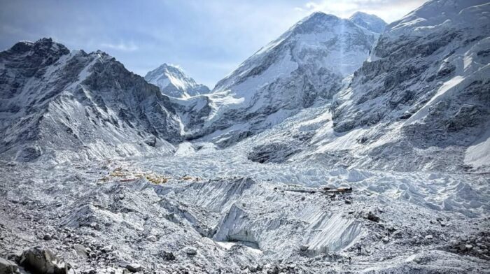 Gernal overview of Everest, the West shoulder, the Khumbu Glacier and the tents of Everest BAse Camp on the ice. 