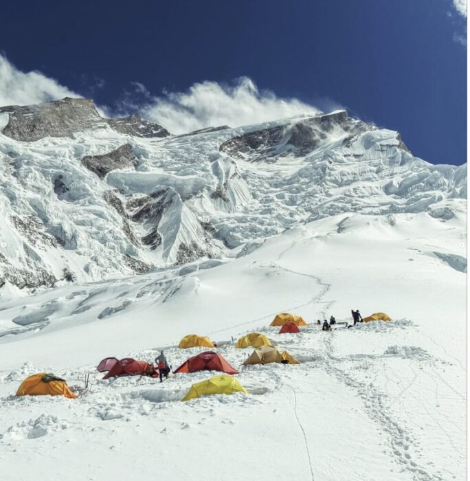 A group of tents on a flatish glacier section at the base of Annapurna.