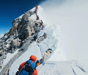 Climbers line up along the summit area of Everest.