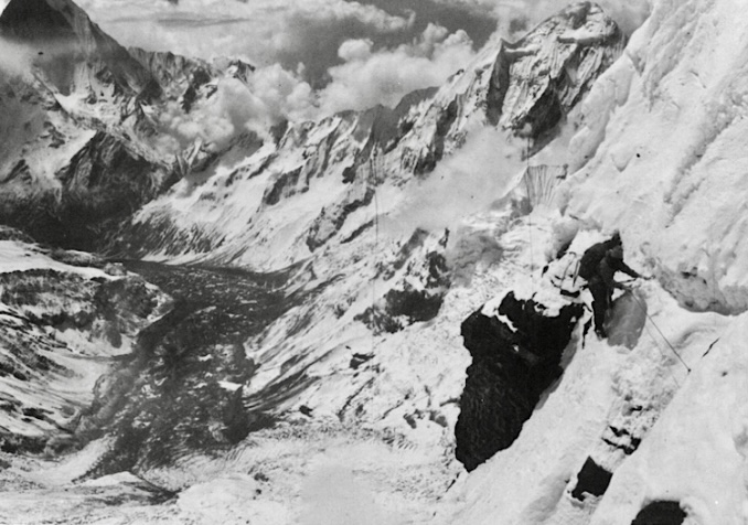 Dougal Haston traversing fixed ropes on the upper ice ridge at 6,705m during the Annapurna South Face expedition.
