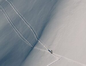 A skier leaves a trace on pristine snow.