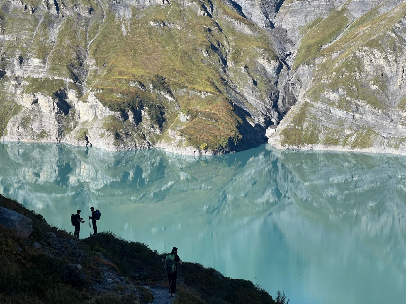 The Lac d’Émosson is one of many reservoirs encountered along the Alpine Passes Trail. 