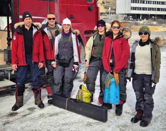 A team of Finnish adventurers pose for the camera in Kangerlussuaq, Greenland