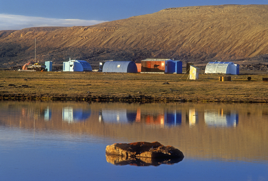 buildings reflected in arctic pond