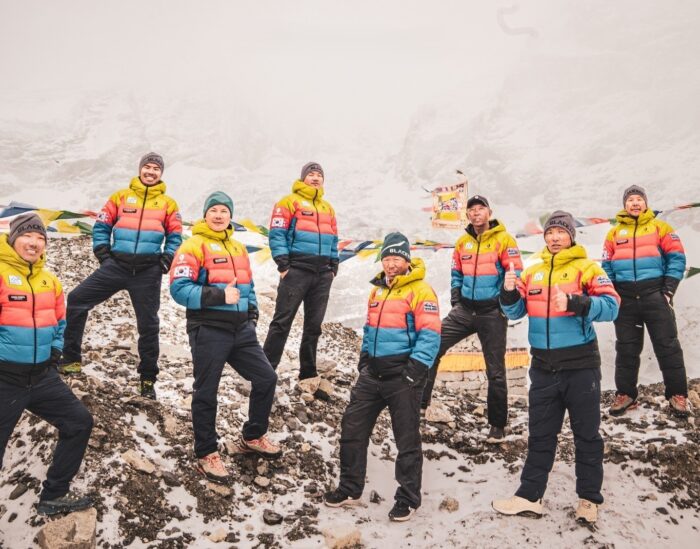 Icefall doctors posing on a scree slope in a foggy day on Everest Base Camp. 