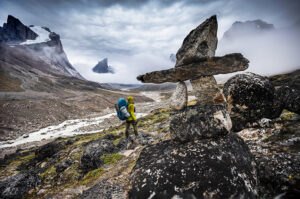 hiker in dramatic arctic mountain landscape