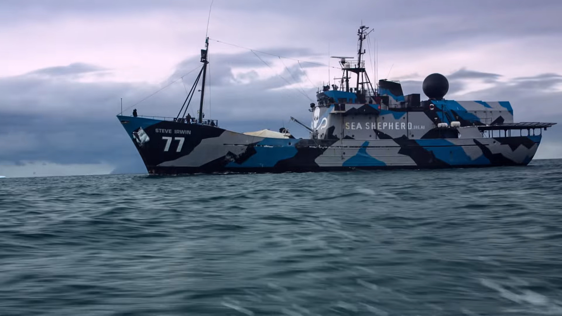 An ocean vessel painted blue and grey