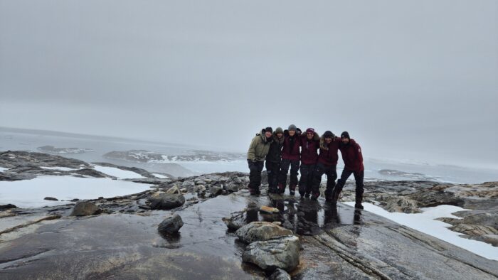 A team of Finnish adventurers standing at the end of the Greenland Ice sheet near Isortoq, on the east coast