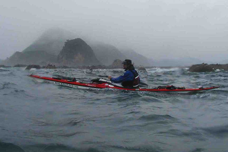 kayaker in very grey conditions