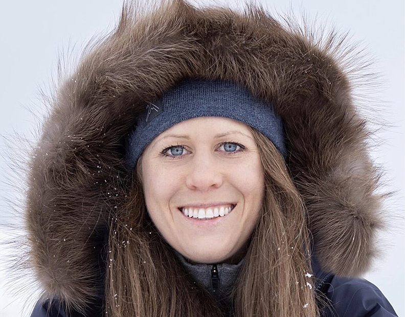 woman with fur parka ruff smiling
