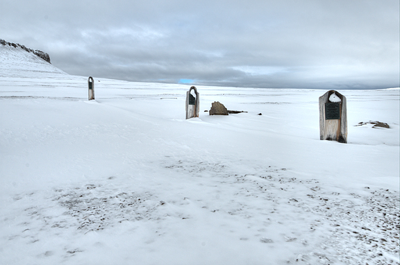 three graves in snow