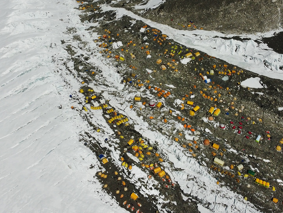 aerial view of big camp of yellow tents