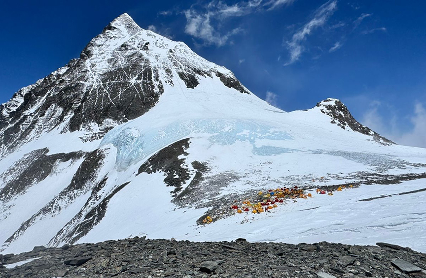 The summit of everest and the tents of the South col as seen from the route to lhotse.