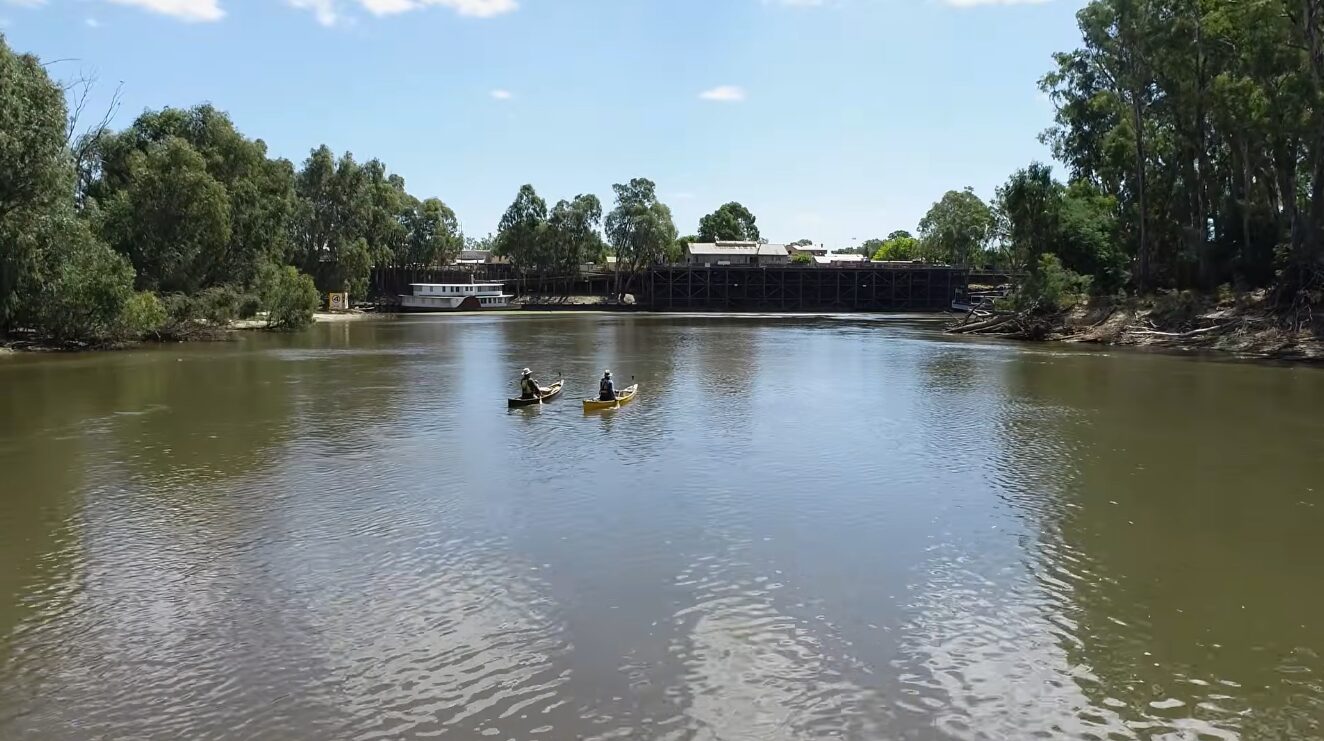 Two men paddling on a river