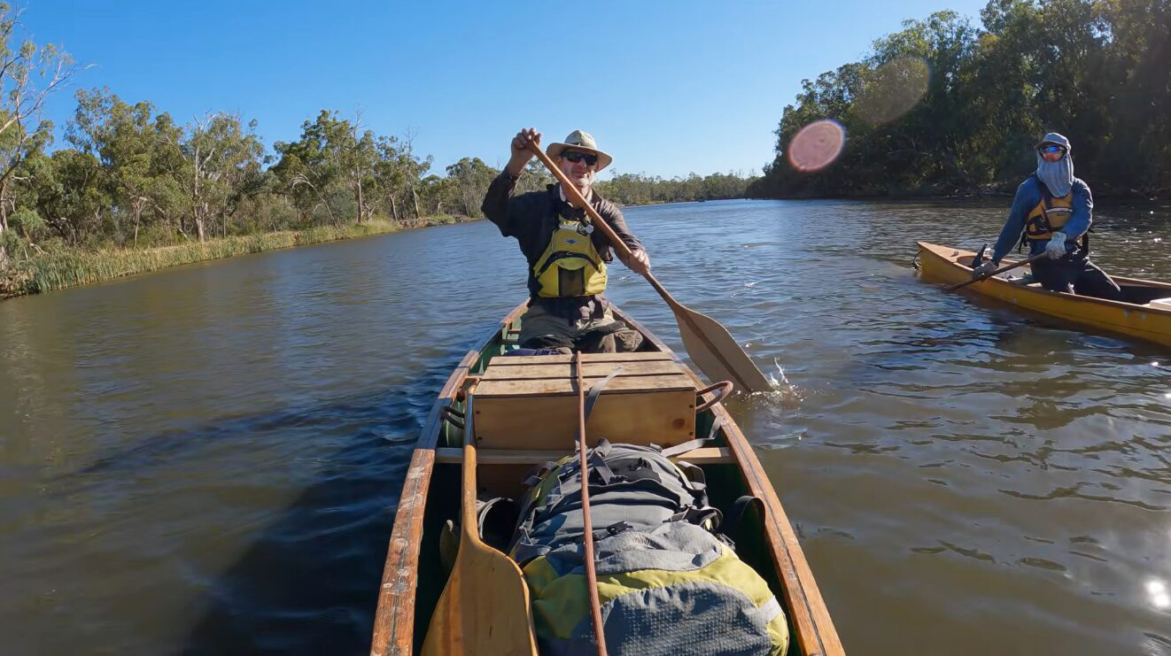 two paddlers face on